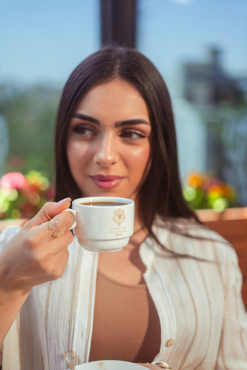 young woman enjoying coffee in baghdad cafe